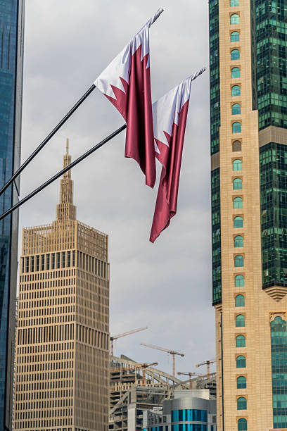 istock Qatar national flags against modern skyscrapers 2251837442
