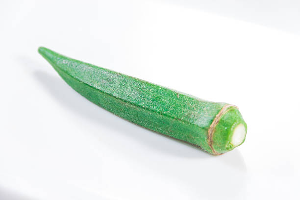 istock Single Fresh Green Okra On White 2251839194