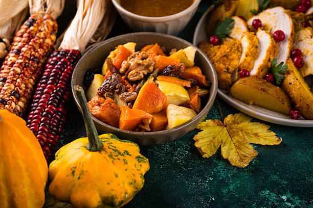 Traditional Thanksgiving day dinner with turkey, baked vegetables, cranberry sauce