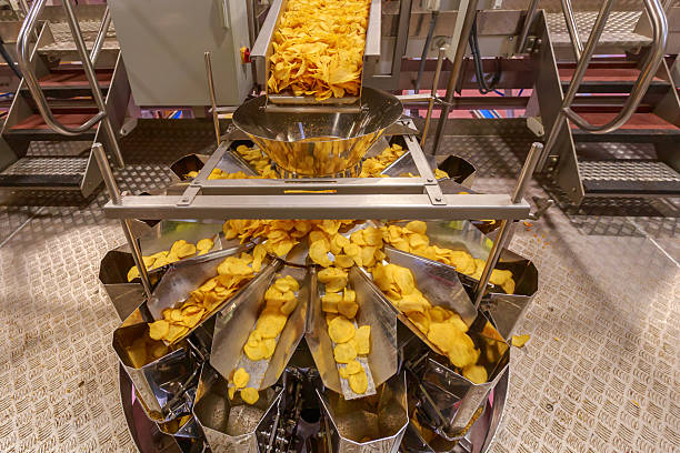 istock Bucket machine for measuring potato chips. 2251839866