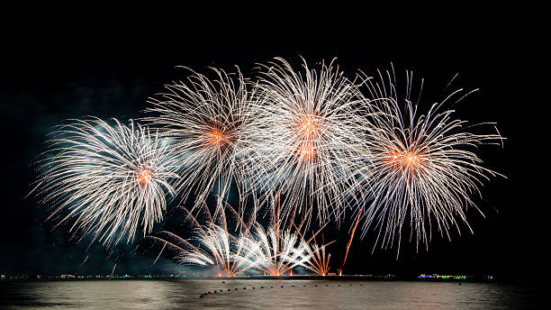 istock Amazing beautiful colorful firework display over sea on celebration night. Fireworks show for happy new year 2251847007