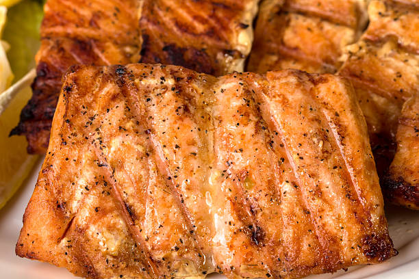 Closeup of delicious grilled salmon fillet. Macro. Can be used as a whole background.