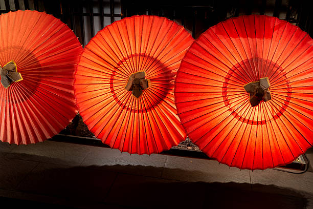 istock Three Glowing Traditional Japanese Red Umbrellas (Wagasa) 2251847526