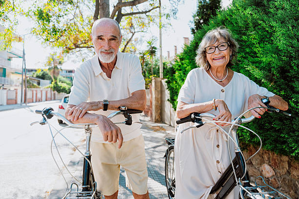 istock Senior couple enjoying active retirement with bicycles 2251848476