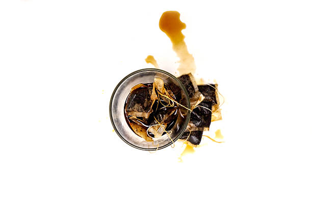 istock used tea bag, inside a glass, isolated on a white background. 2251849212