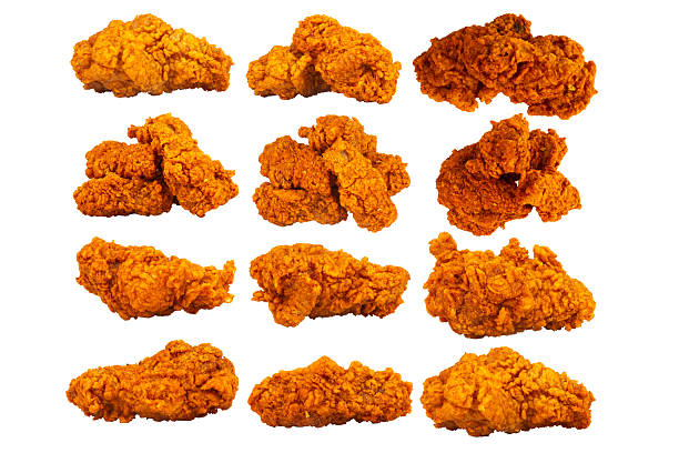 close up focus woman hand hold fried chicken for eat,girl with fast food concept