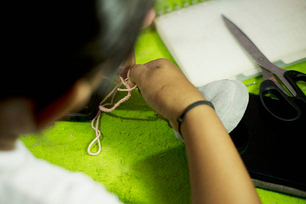 Working in the sewing studio. Close up
