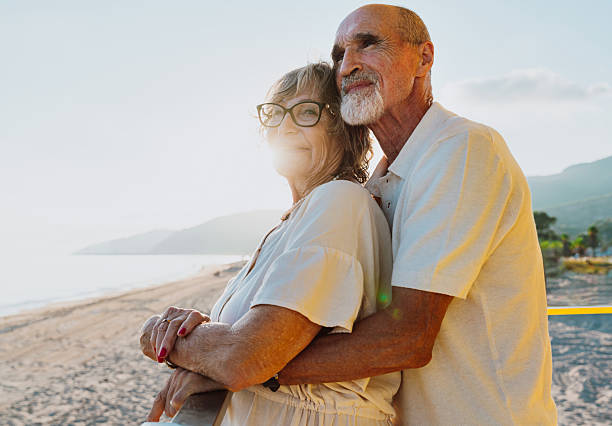 istock Senior couple enjoying summer vacation on elevated beach 2251853988