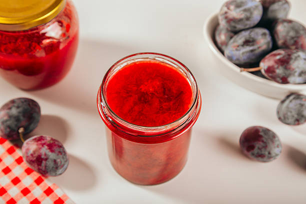 Homemade plum jam and fresh organic plums