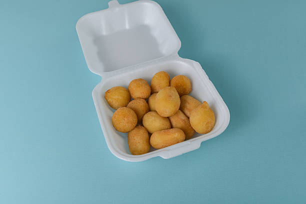 istock Appetizer set - coxinha and cheese balls with bright props 2251859052