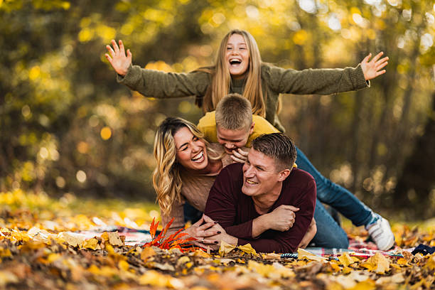 istock Family Playing In Park 2251863167
