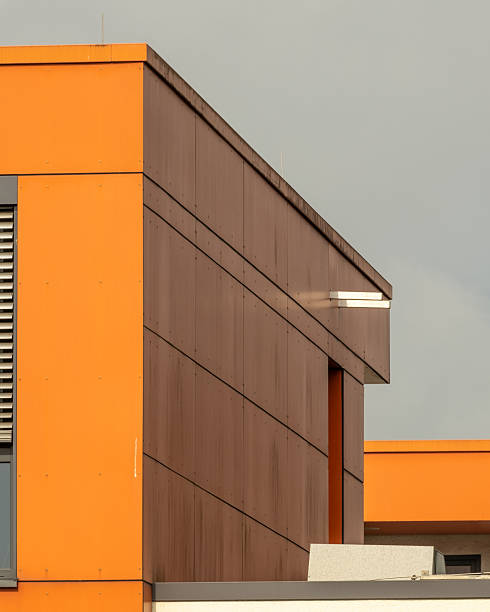 istock ultra modern office building with windows and orange walls 2251864793