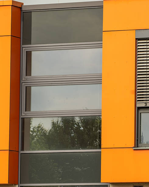istock ultra modern office building with windows and orange walls 2251864810