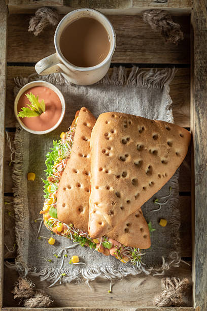 istock Fresh and tasty sandwich with salad, pepper, corn, and ham 2251868641