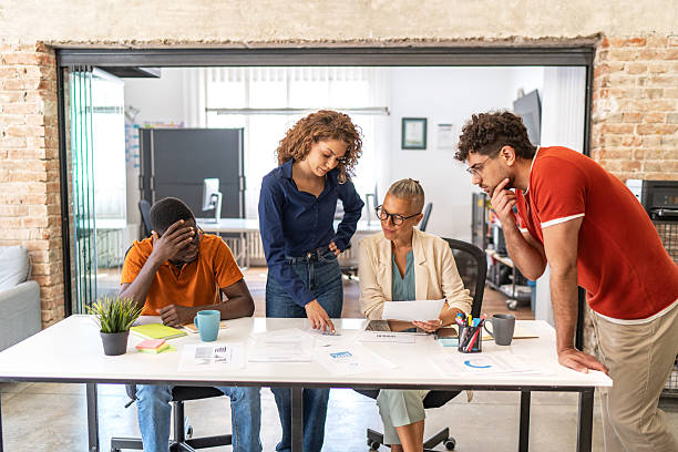 istock Diverse business team collaborating during stressful office meeting 2251875547