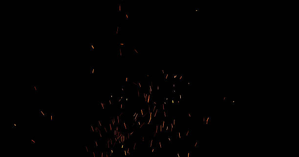 istock Fire sparks flying in the air, isolated on a black background. 2251876641