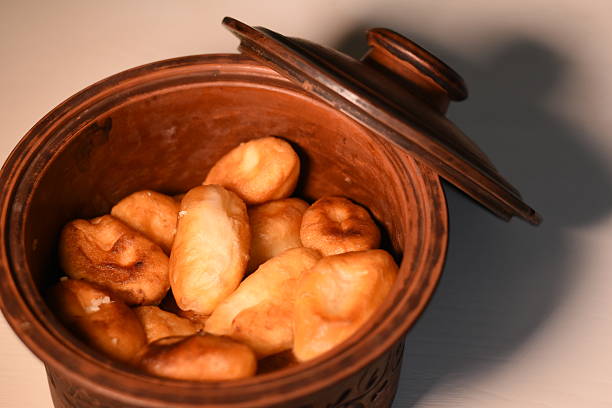 istock Clay dish with homemade pastries on a light table 2251879887