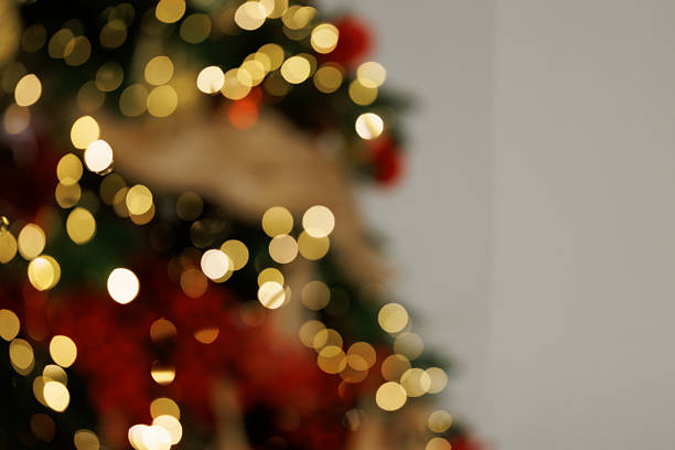 Close up of balls on christmas tree. Bokeh garlands in the background. New Year concept. High quality photo