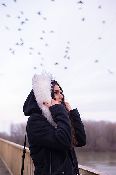 istock Young sad woman outdoors in winter 2251881076