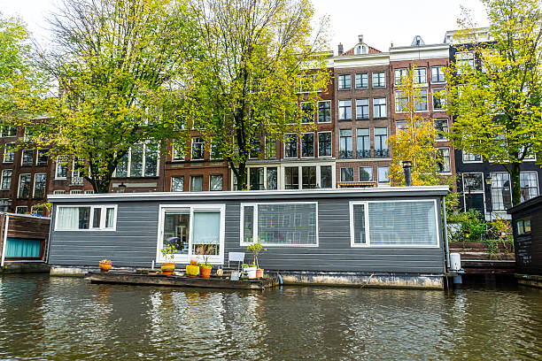 A floating house in Amsterdam canal. Boat home