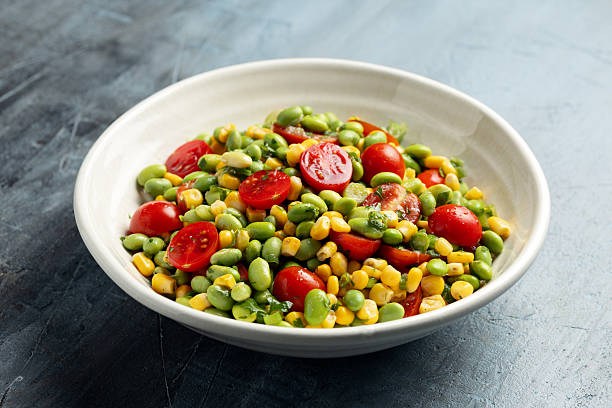 Edamame bean salad with sweet corn, tomato, green onions. Healthy food
