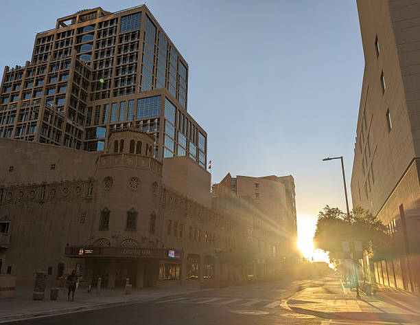 An historic downtown Galveston street lined with old buildings and shoppes reminiscent of the old west.  Many of these buildings, built in the 1800s,  withstood the massive hurricane of 1900 and still stand in use today.