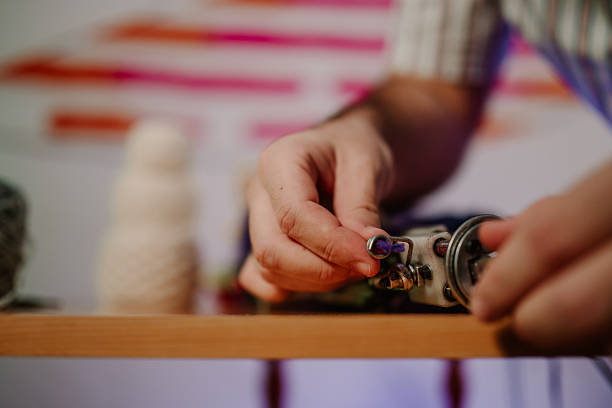 istock Hands crafting yarn into handmade item 2251893512