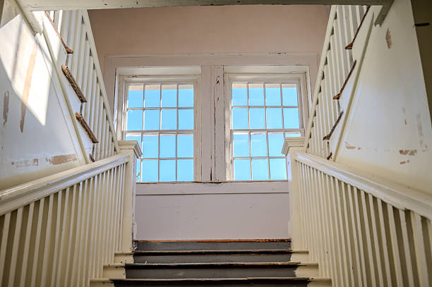 beautifully decorated old wooden stairs in an abandoned residential building. monumental wooden balustrade.