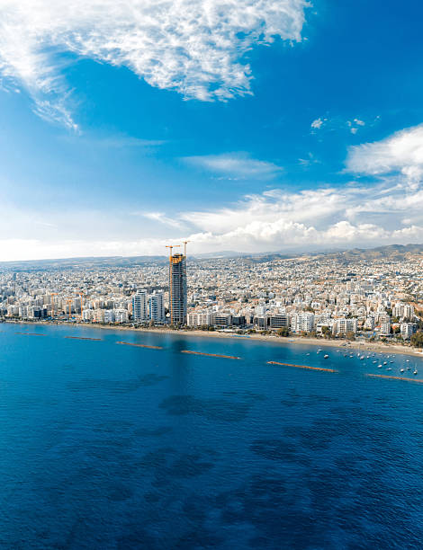 istock Modern skyscraper under construction towering above coastal city on sunny day. Limassol, Cyprus 2251898418