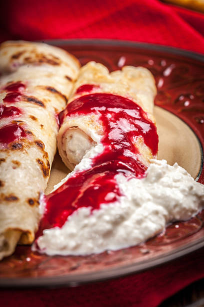 istock Rolled crepes stuffed with cottage cheese. 2251900978