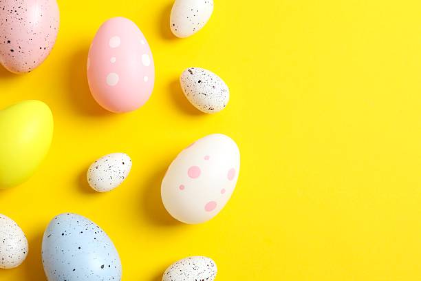 istock Happy Easter. Colorful eggs on color background, space for text or advertising 2251901633