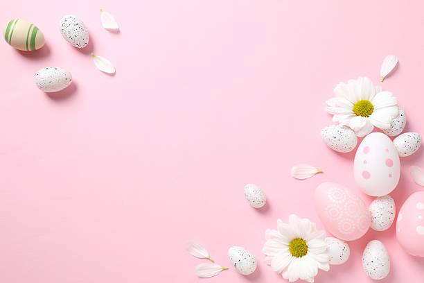 istock Happy Easter. Colorful eggs and white spring flowers on color background, space for text or advertising 2251901673