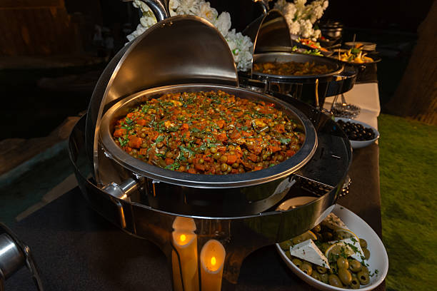 istock A stainless steel chafing dish filled with mixed vegetable curry at a catered event. 2251903731
