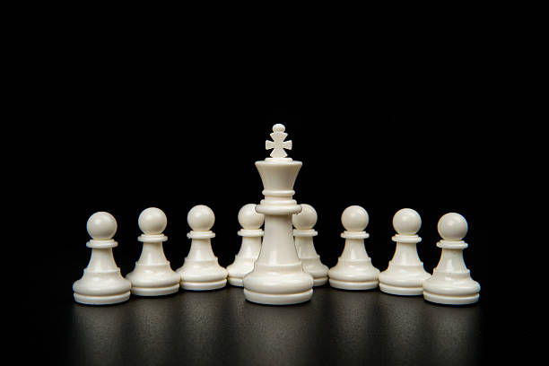 istock White king leading pawns on dark background representing leadership, authority, guidance, vision, and strategic direction in business, management, and organizational success. 2251907734