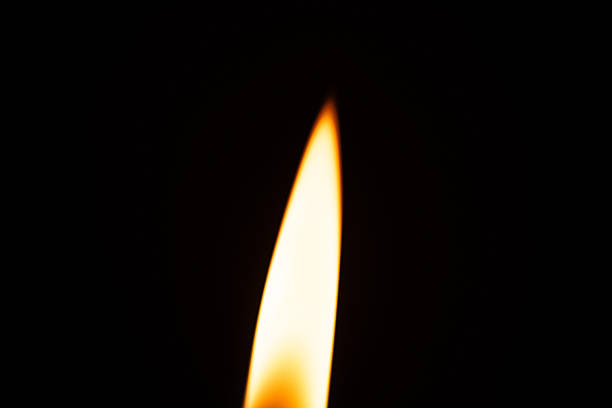 A detailed macro photograph of a candle flame, capturing the warm glow, delicate flicker, and atmospheric texture of burning wax. Perfect for themes of calm, spirituality, ambiance, and fine art.