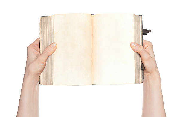 istock Hands holding an open ancient book with blank pages, isolated on transparent background. Ideal for education, history, literature, archival, and vintage-themed projects 2251909450