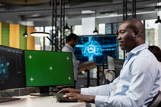 istock Green screen PC used by programmer in startup company office testing AI 2251912126