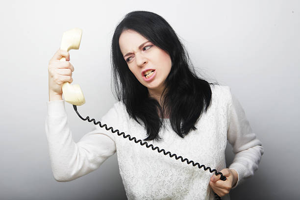 furious young girl with vintage phone