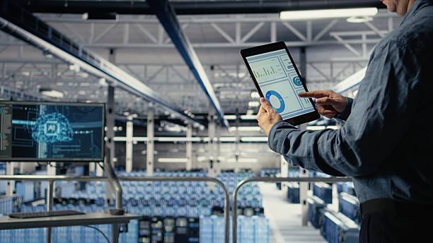istock Close up of data center employee checking infrastructure diagnostics on tablet 2251915854