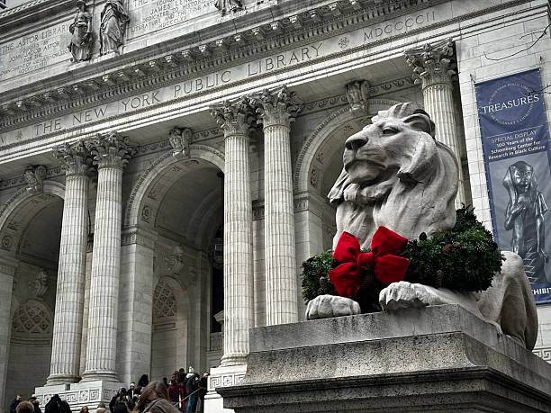 New York, New York, USA. Dec 13, 2025 - the main entrance of the New York Public Library during Christmas Season with its decorated Lion statues.
