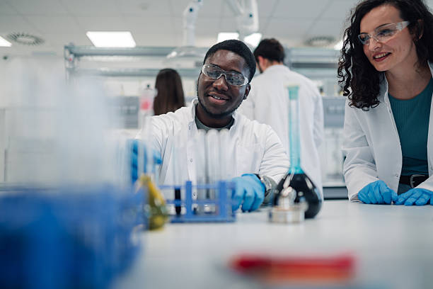 istock Diverse scientists conducting chemistry experiment in laboratory 2251917726