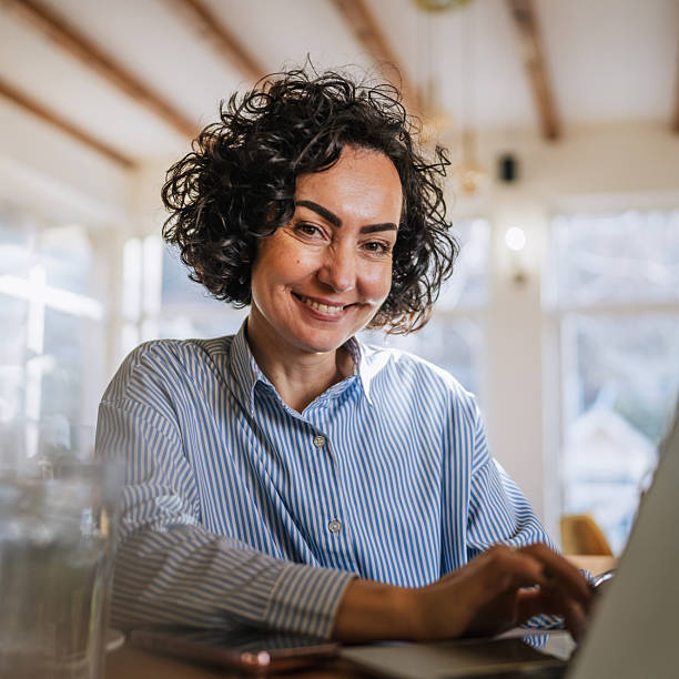 istock Woman working remotely on laptop in cafe 2251918350