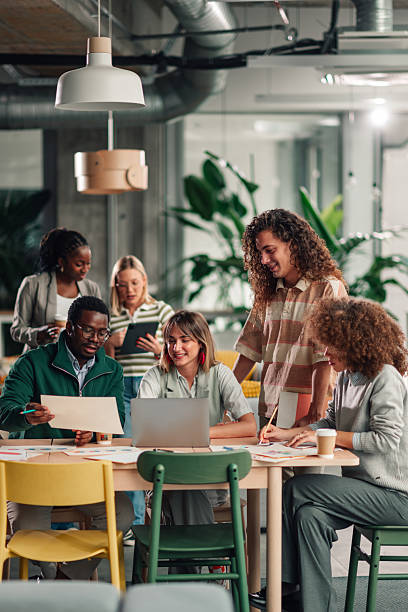 istock Diverse business team collaborating in creative modern office 2251918365