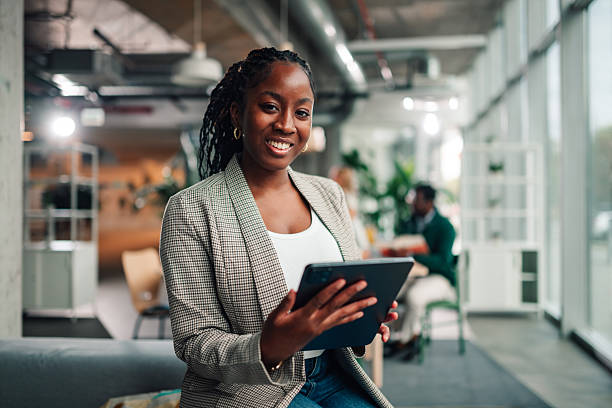 istock Confident black businesswoman using digital tablet in modern office 2251918377