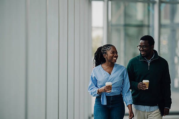 istock Colleagues walking and talking during coffee break 2251918557