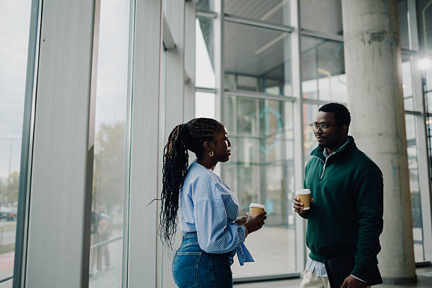 istock Coworkers discussing business during coffee break in office 2251918559