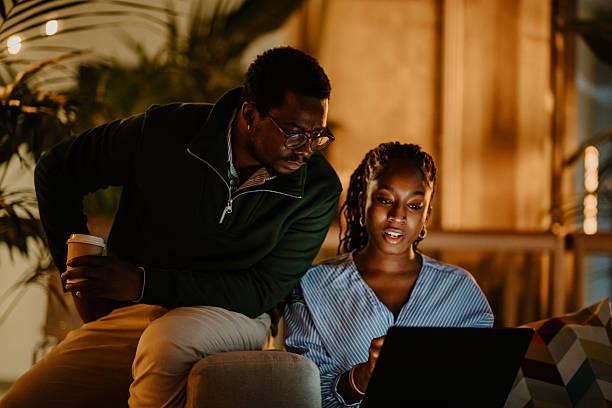istock Colleagues collaborating on laptop at office during night 2251918596