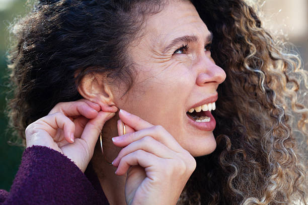 Close-Up Side View Of Young Woman With Pierced Ear