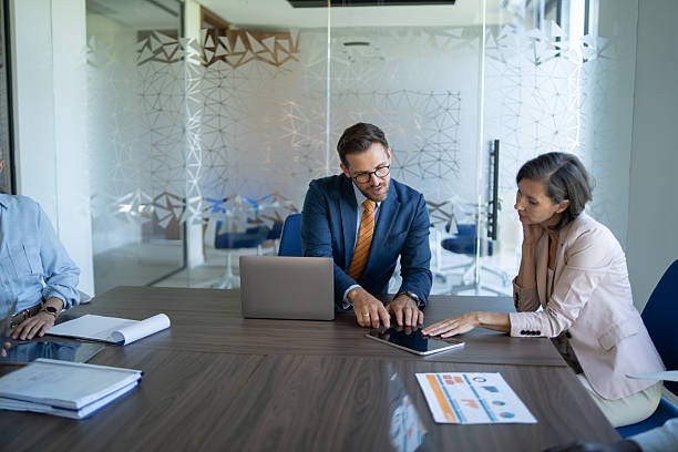 istock Business people working together using digital tablet in modern office 2251920541