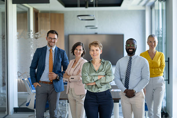 istock Confident business team smiling at camera in modern office 2251920574
